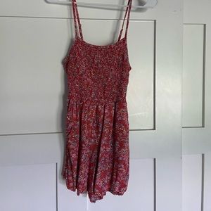 Red floral Romper gently worn once bought for 46 Is a M fits like a small.